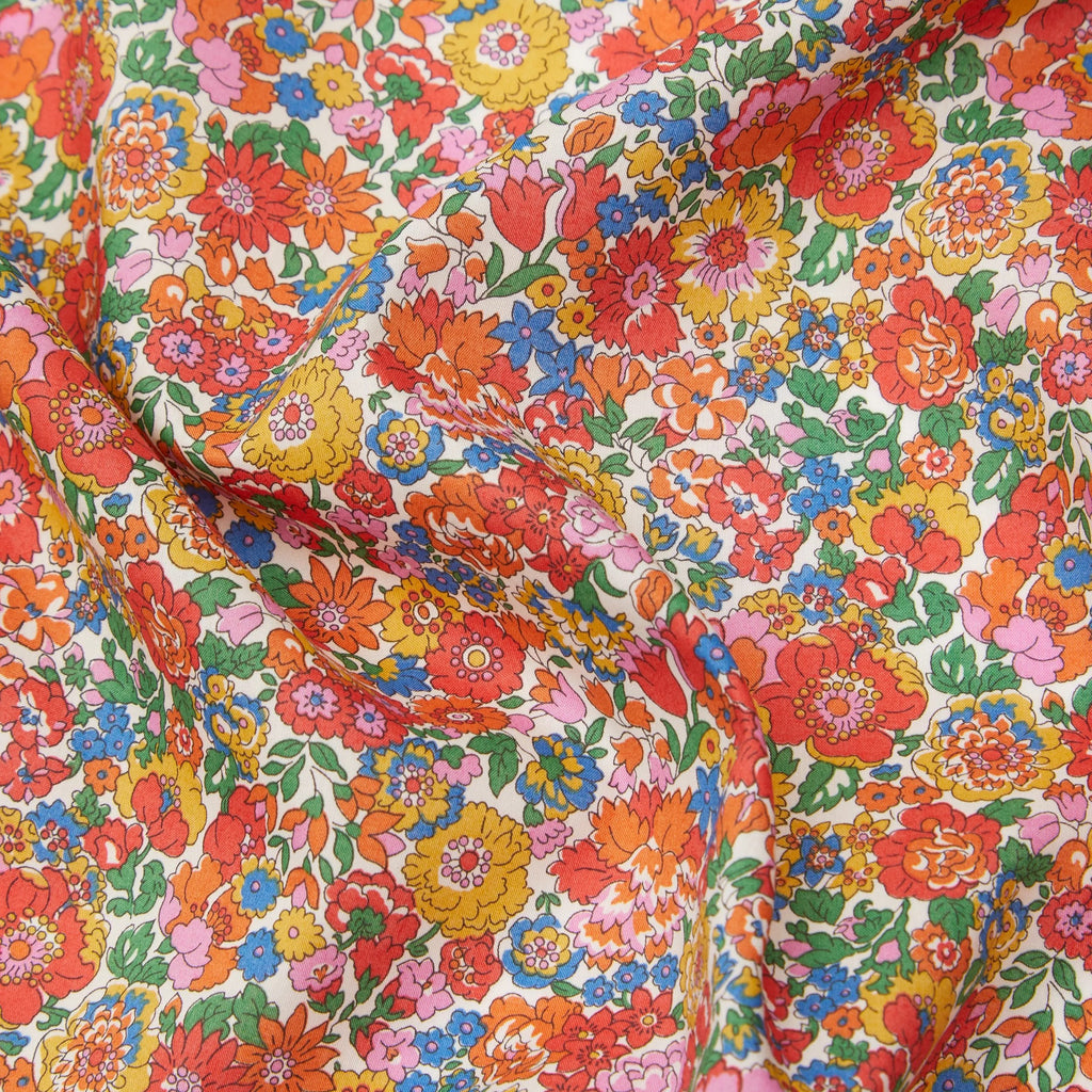 Patchworkstof fra Liberty London Tanal Lawn med navnet Nell, Annie and May rød gul orange CPHquilt krøllet motiv